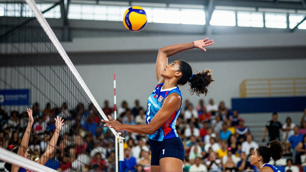 A female volleyball player mid-air performs a powerful spike during a match in a sun-drenched arena.